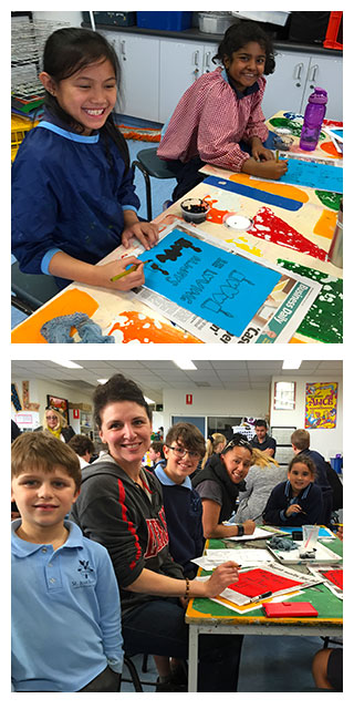 Students and families at St Joachim's School making prayer flags