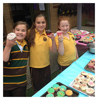 St Thomas the Apostle students with cupcakes to fundraise for the RSPCA
