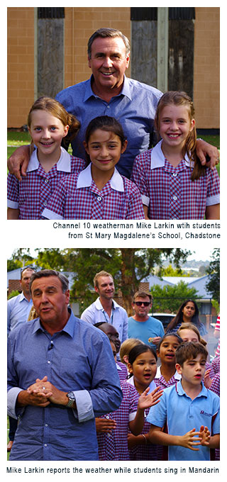 Channel 10 weatherman Mike Larkin with students from St Mary Magdalene's School, Chadstone.