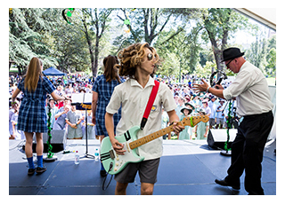 Student performing at the concert in the park