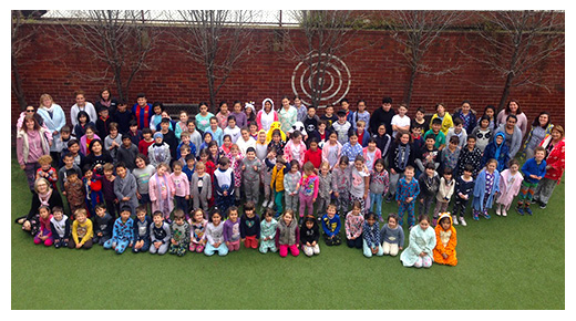 Group image of St Margaret Mary's students and staff in pyjamas to raise awareness about homelessnss