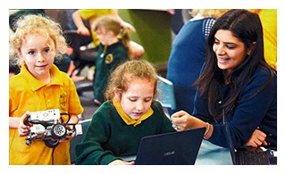 Jemmima and Mackenzie work on robotic programming with the help of Prep teacher Angelica Pangratis