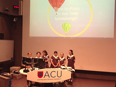 Students from St James', Brighton, presenting at ACU (Australian Catholic University) Kids Conference.