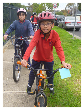 St Leo students riding their bikes as part of family week