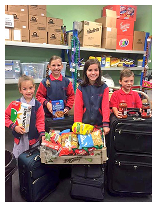 Ella, Caitlyn, Ivanka & Bailey, collected $1000 worth of food for Asylum Seekers Resource Centre Foodbank at Christ the Priest Catholic Primary School in Caroline Springs