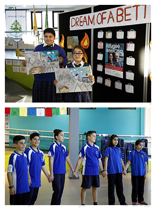 Picture of students with their artwork celebrating Wrold Refugee Day 2017