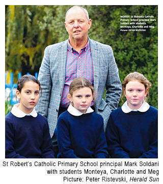 Principal of St Robert's Catholic Primary School, Newtown, Mr Mark Soldani with some of his students.