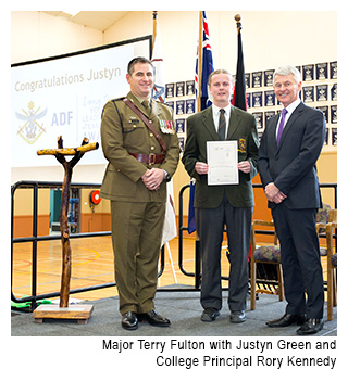 MacKillop Catholic Regional College student Justyn Green is presented with the Long Tan Award by Major Terry Fulton, with college principal Rory Kennedy