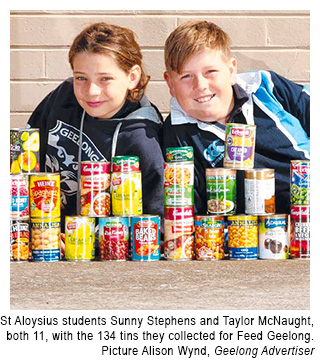 St Aloysius School Queenscliff students with cans they collected for Feed Geelong, courtesy The Geelong Advertiser
