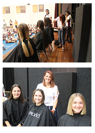 Year 12 students Natalie, Hannah and Hannah having over 20 cm of their hair cut.