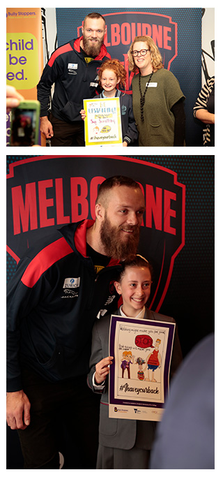 Students from two of Melbourne’s Catholic schools being named winners in the #ihaveyourback poster competition.