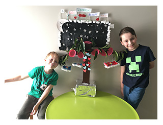 Brothers Alessandro (Year 3) and Orlando (Prep) with their sculpture ‘A kiss goodnight’