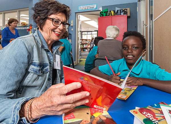 Teacher reading with a student