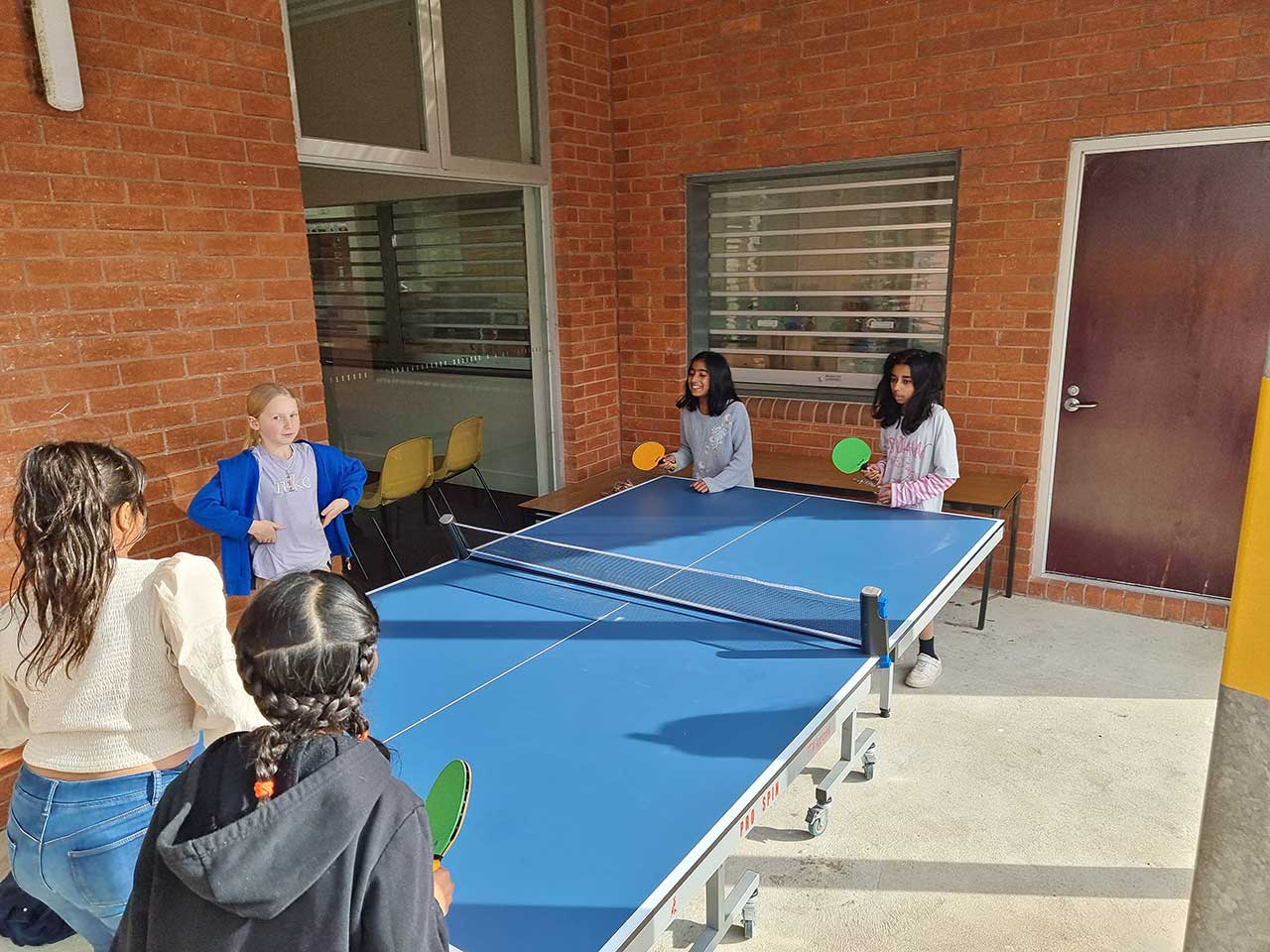 students playing table tennis