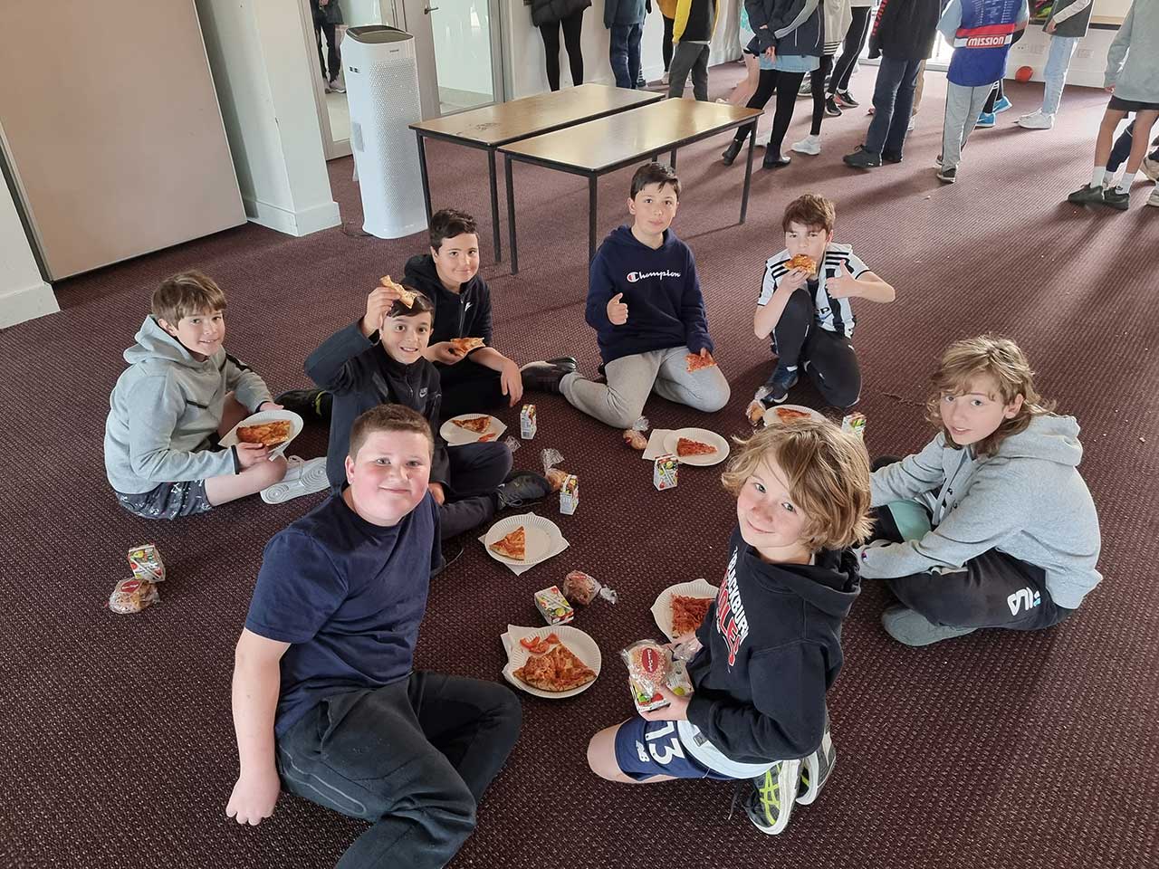 students having a pizza lunch