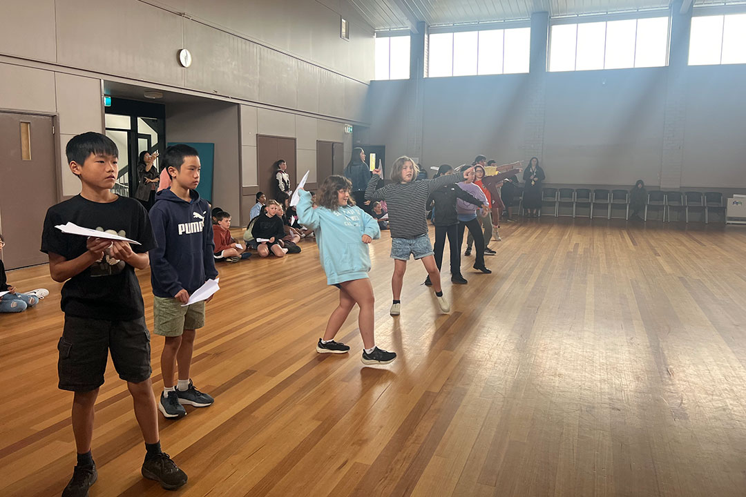 students throwing their paper planes