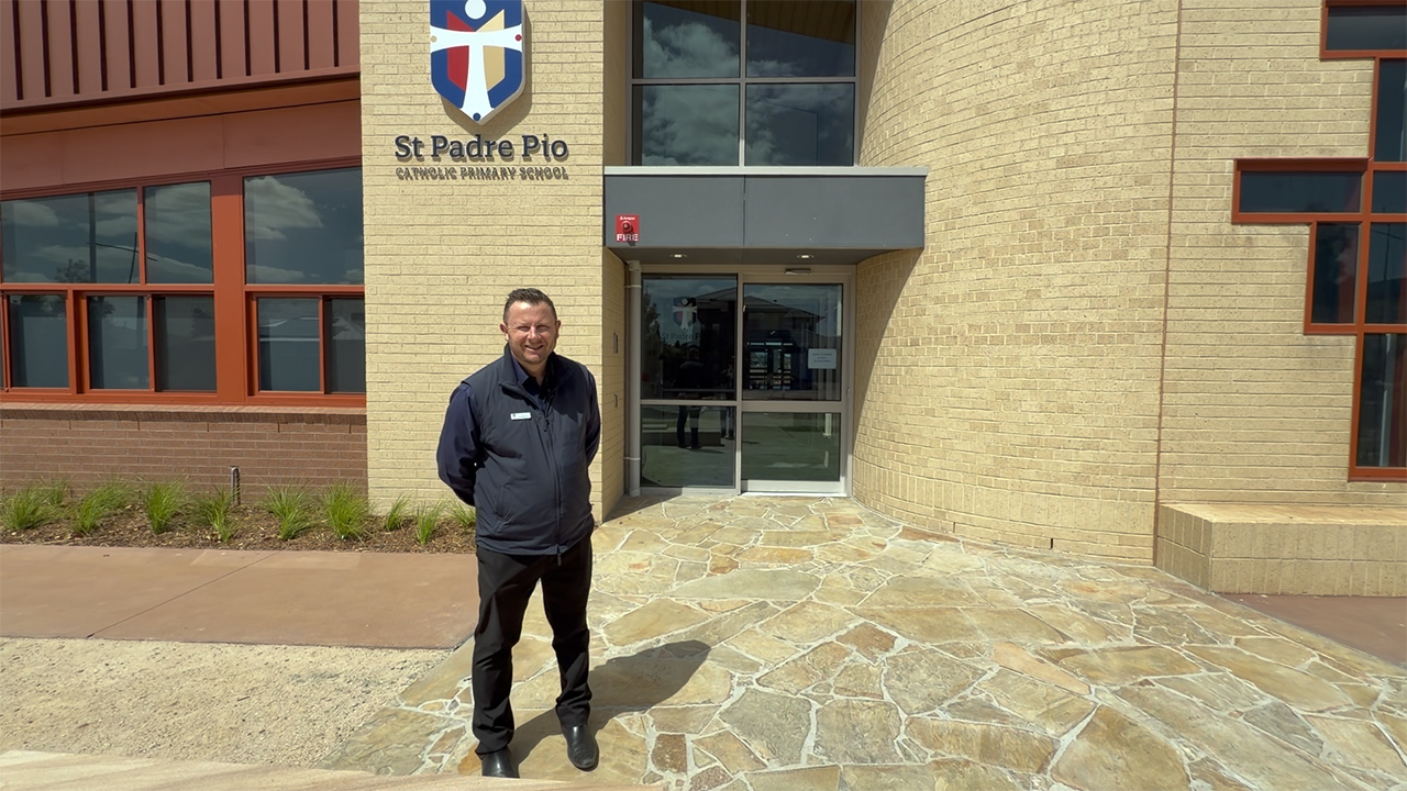 Principal Daniel Bermingham outside the school