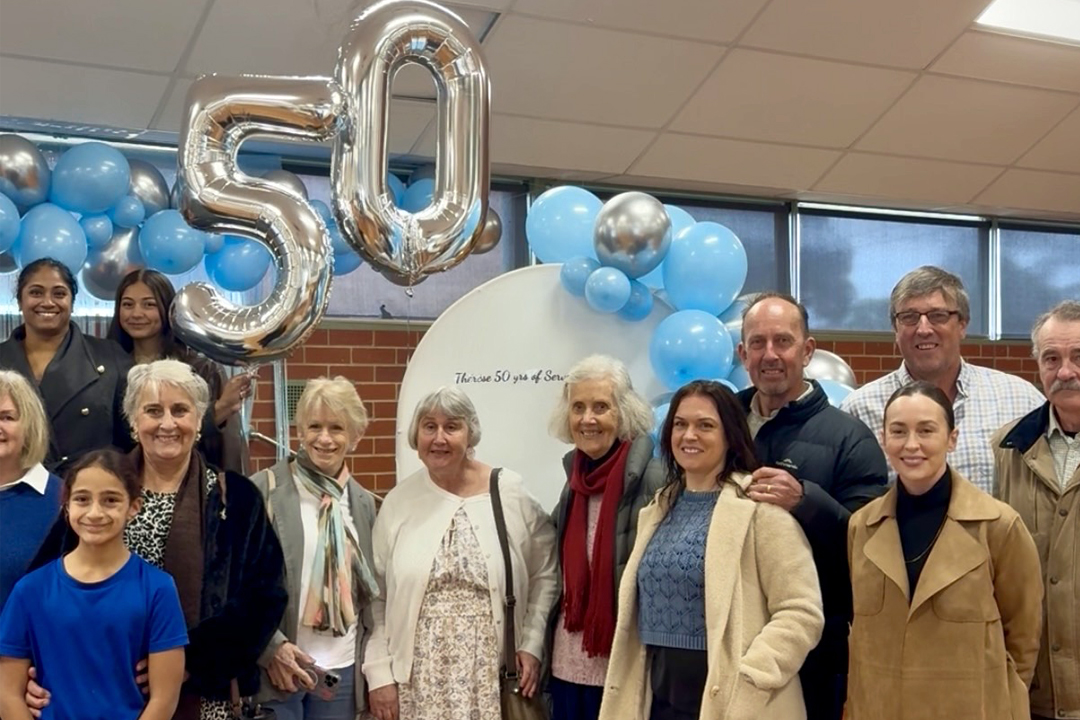 Therese and her family, celebrating at Our Lady of Perpetual Help School.