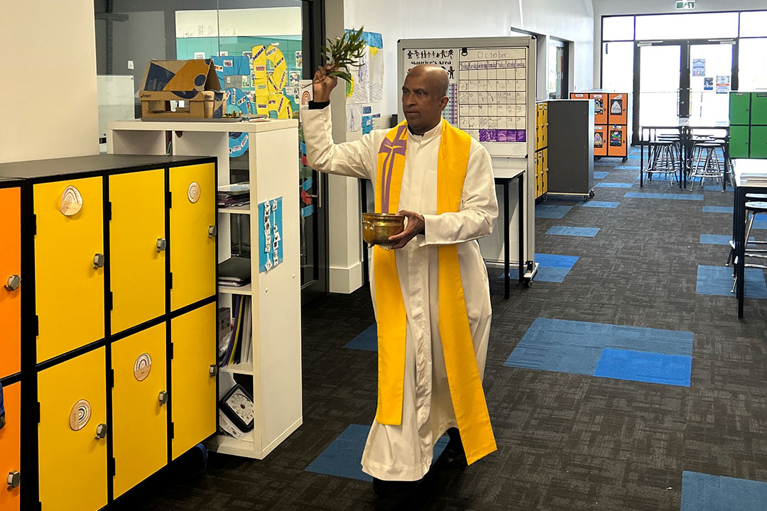 Fr Prakash Cutinha blessing the building