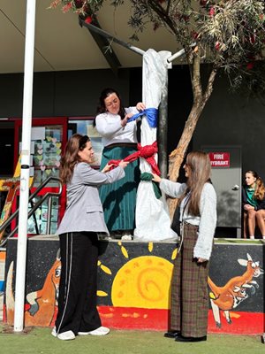 cutting the ribbon on the peace pole